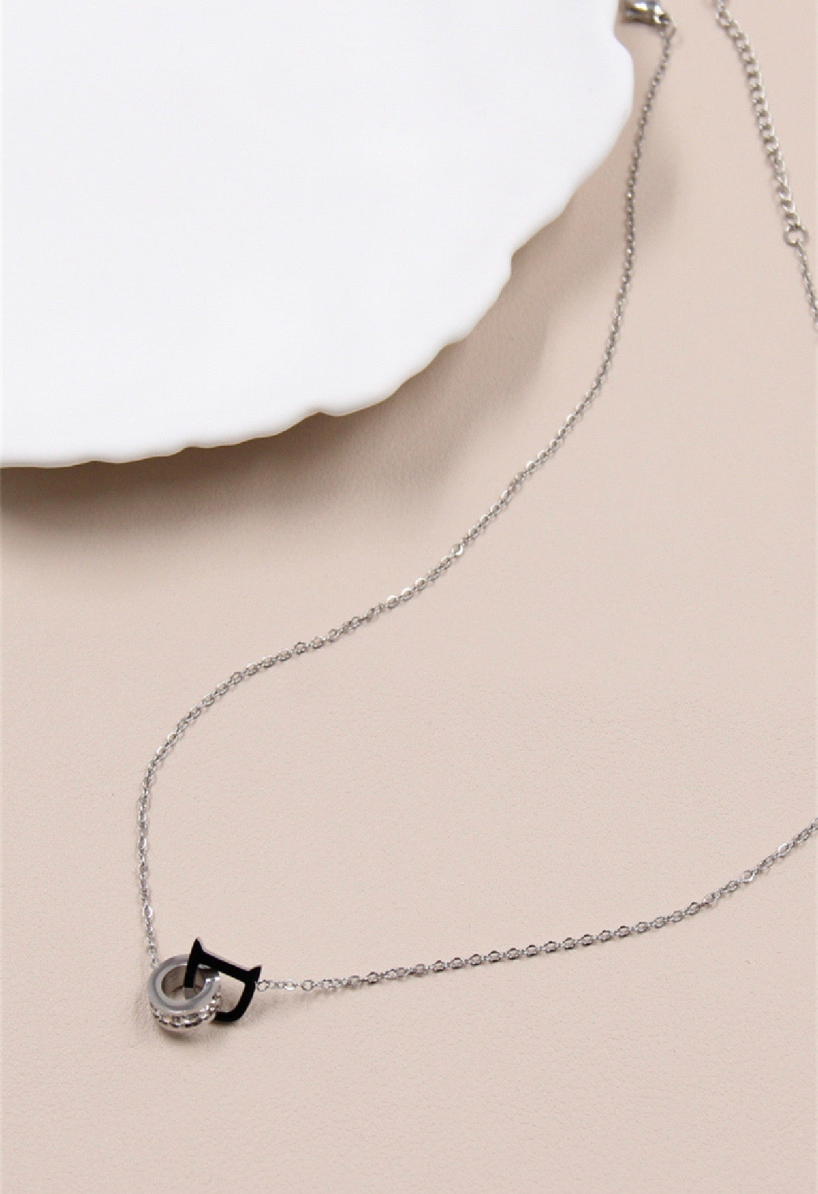 "D" ring necklace decorated with rhinestones