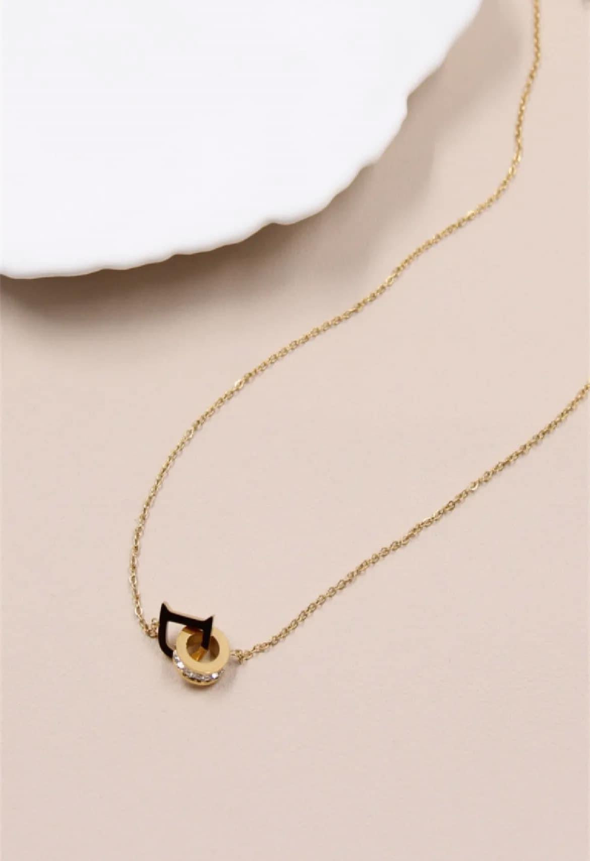 "D" ring necklace decorated with rhinestones